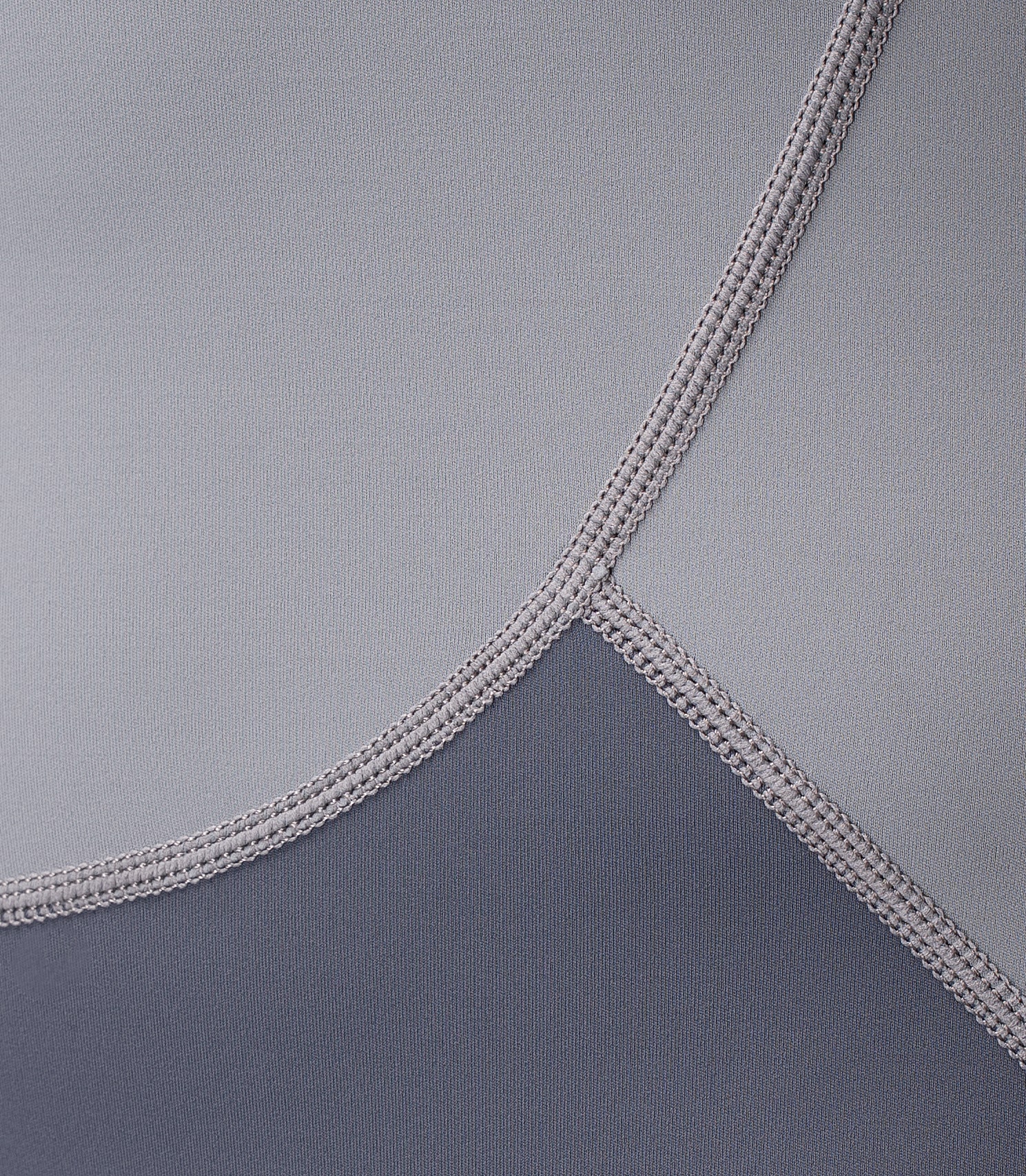 Close-up of Zhik Youth Hybrid Gear Performance Skiff Suit in Grey showing high-stretch flatlock stitching for comfort