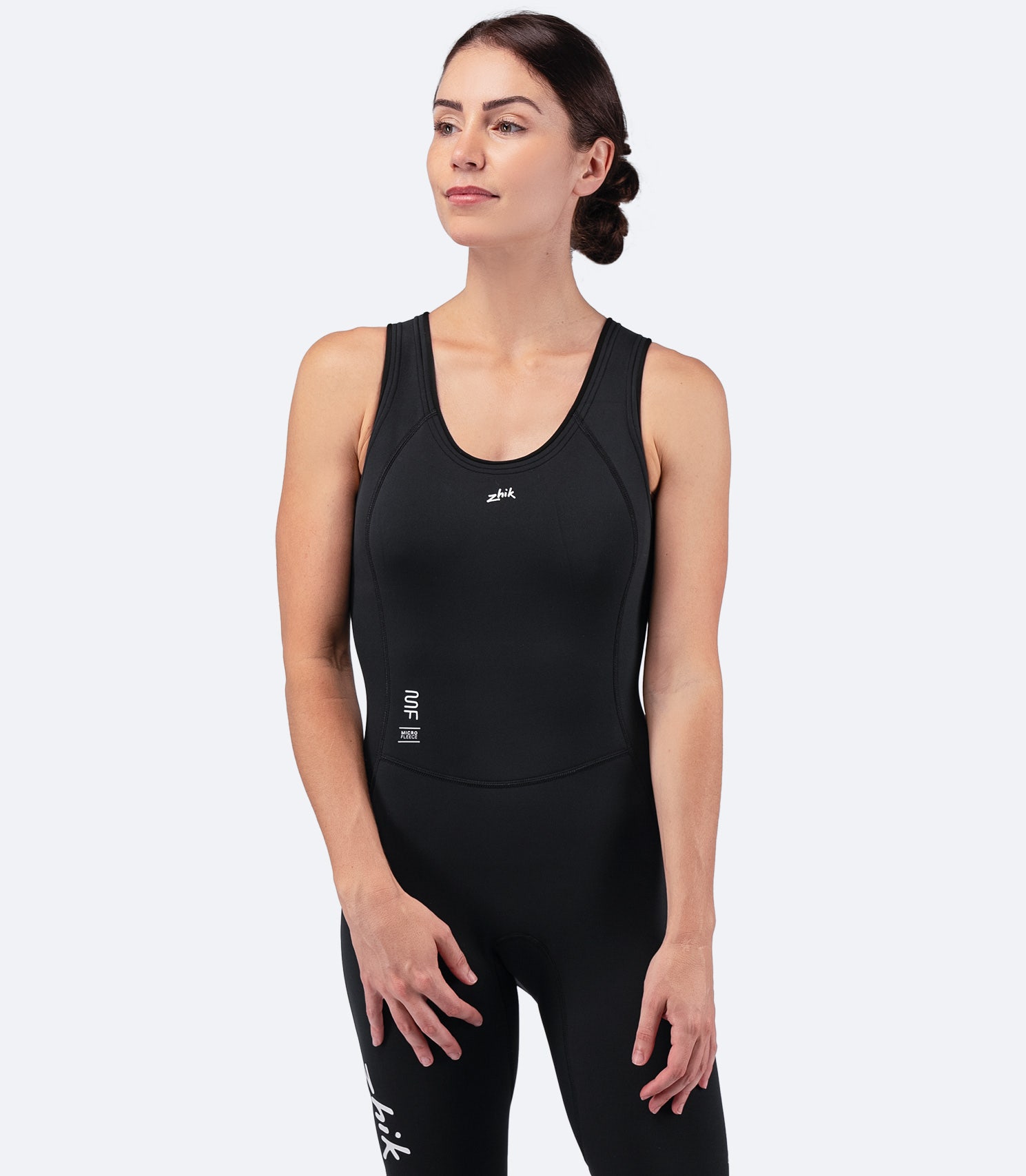 Zhik Women's Microfleece Skiff Suit in black, front view from knees to head, showing insulated design and flexible stretch fabric