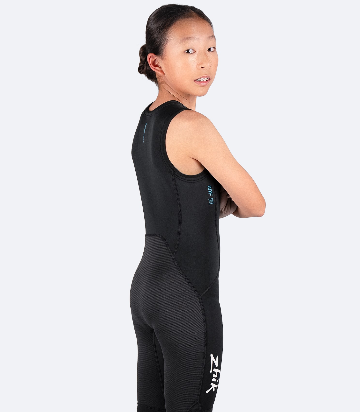 Back view of Zhik Youth Microfleece Skiff Suit, highlighting high-rise seat and abrasion-resistant protection on extended shin