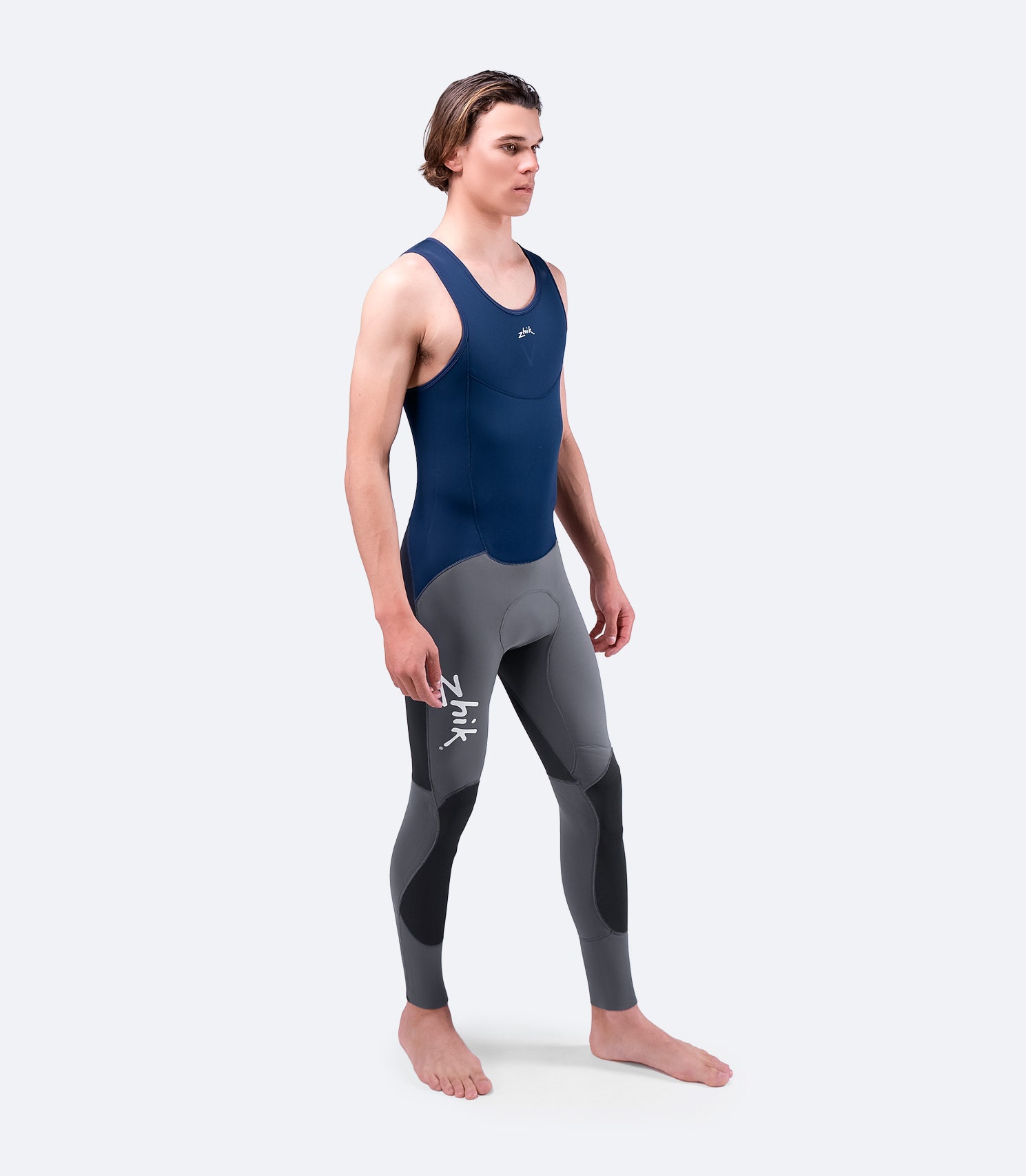 Side view of navy Zhik Men's Superwarm V Skiff Suit, highlighting ergonomic fit, flexible neoprene panels, and reinforced abrasion-resistant areas.