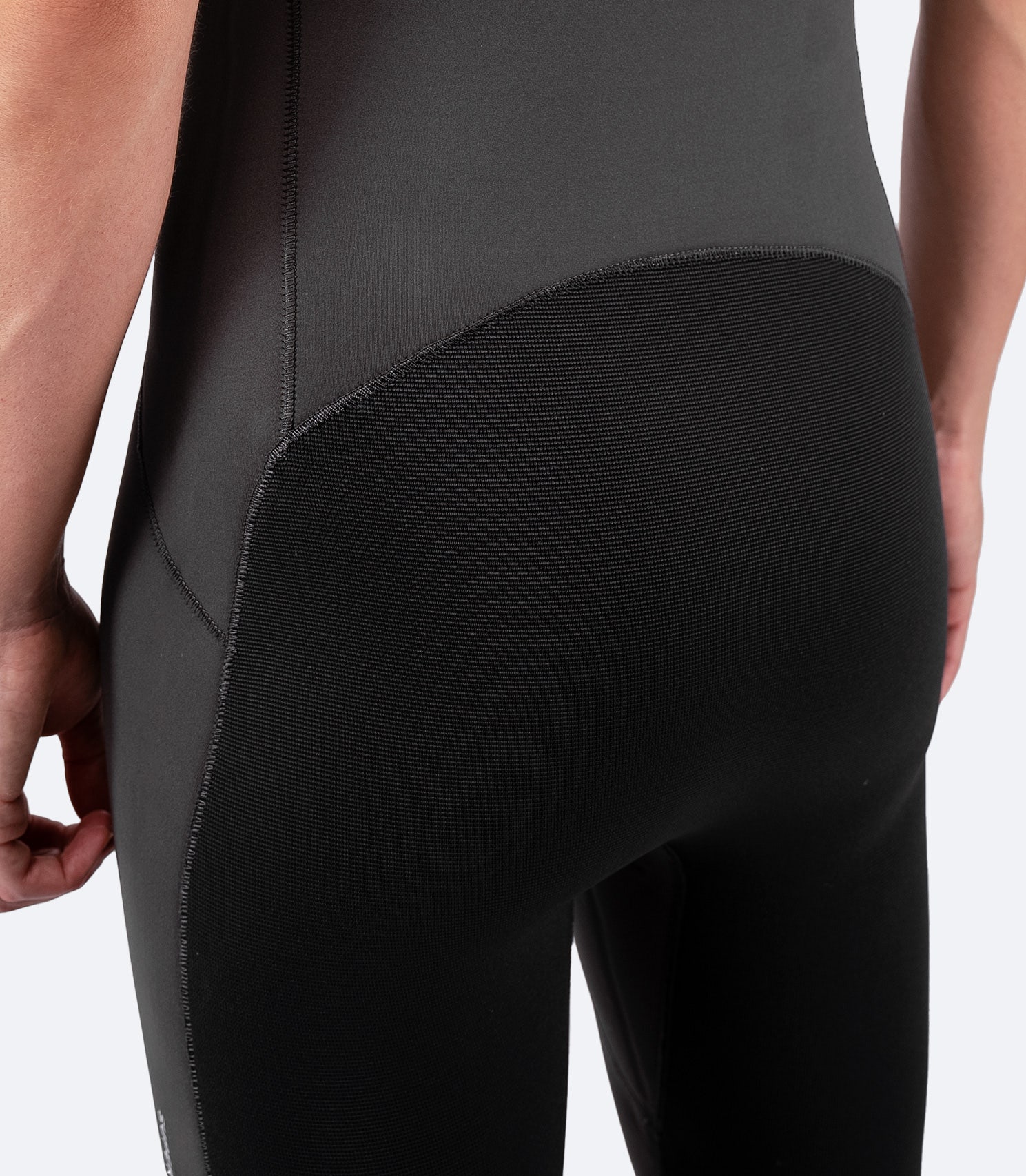 Rear view of Zhik Women's Superwarm Skiff Suit featuring a high-rise seat and ZhikTex II reinforcement for durability and protection