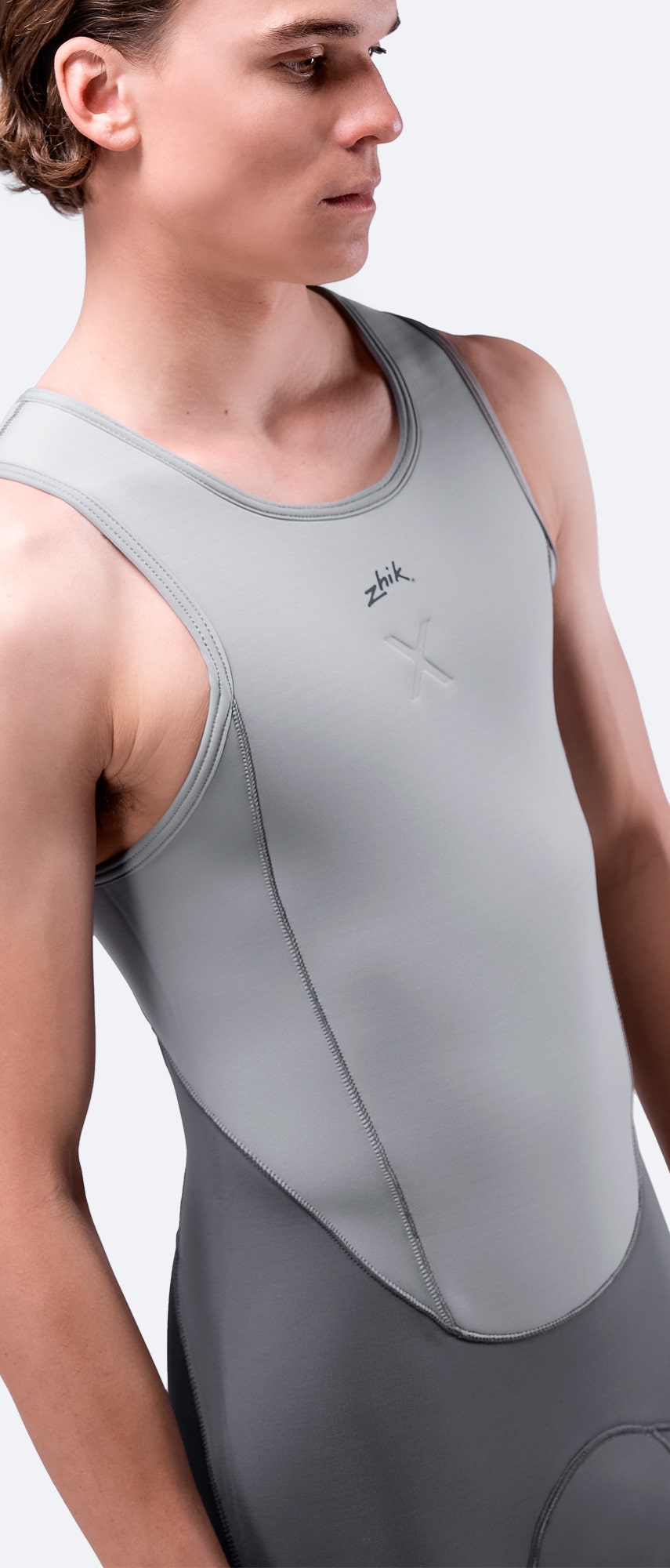 Front side angle close-up of grey Superwarm X Skiff Suit, highlighting torso fit, Hydrobase fleece lining, and wind-resistant neoprene.