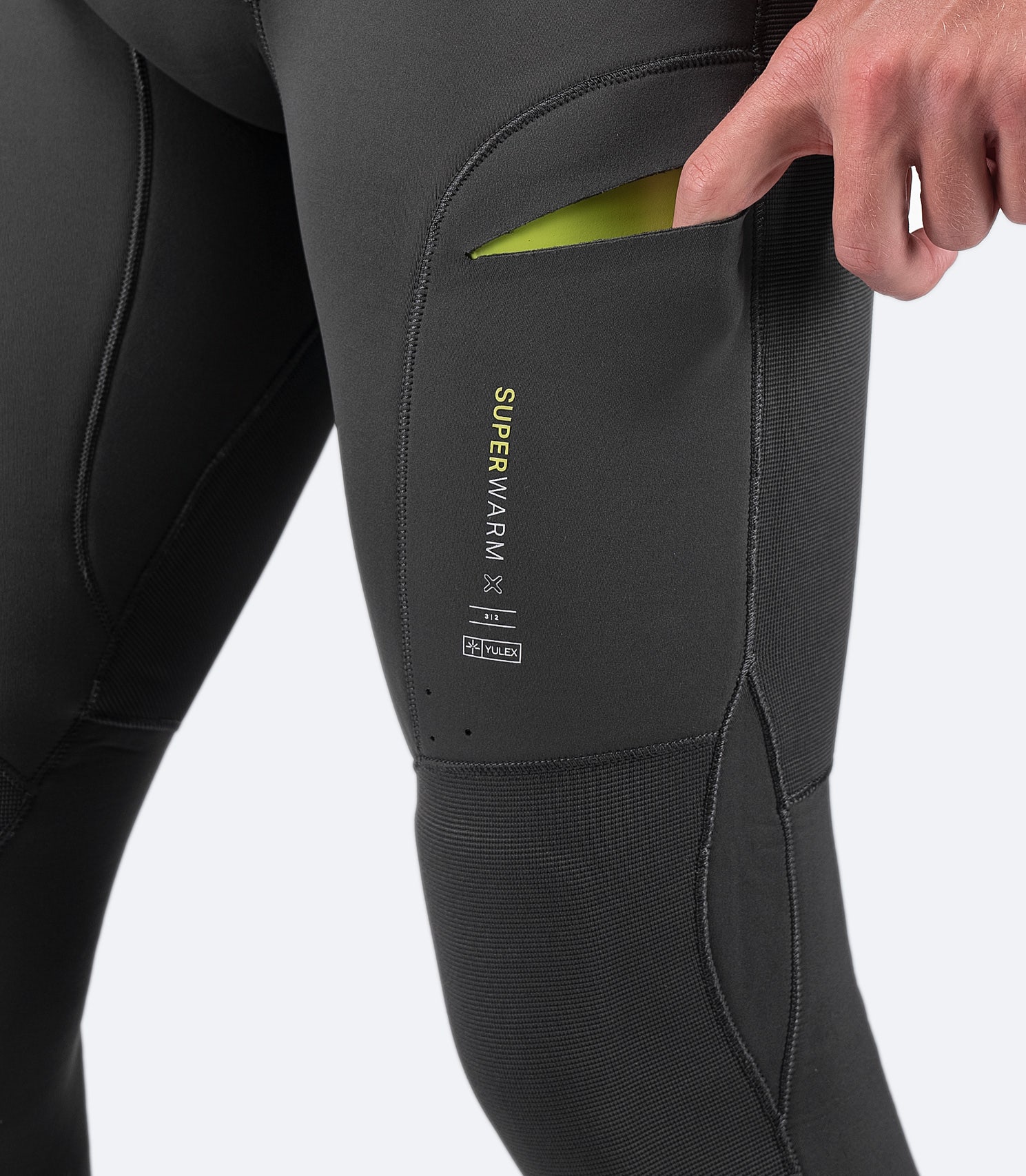 Close-up of Slimline thigh pocket on Zhik Men's SuperwarmX Skiff Suit, designed for easy access and secure storage