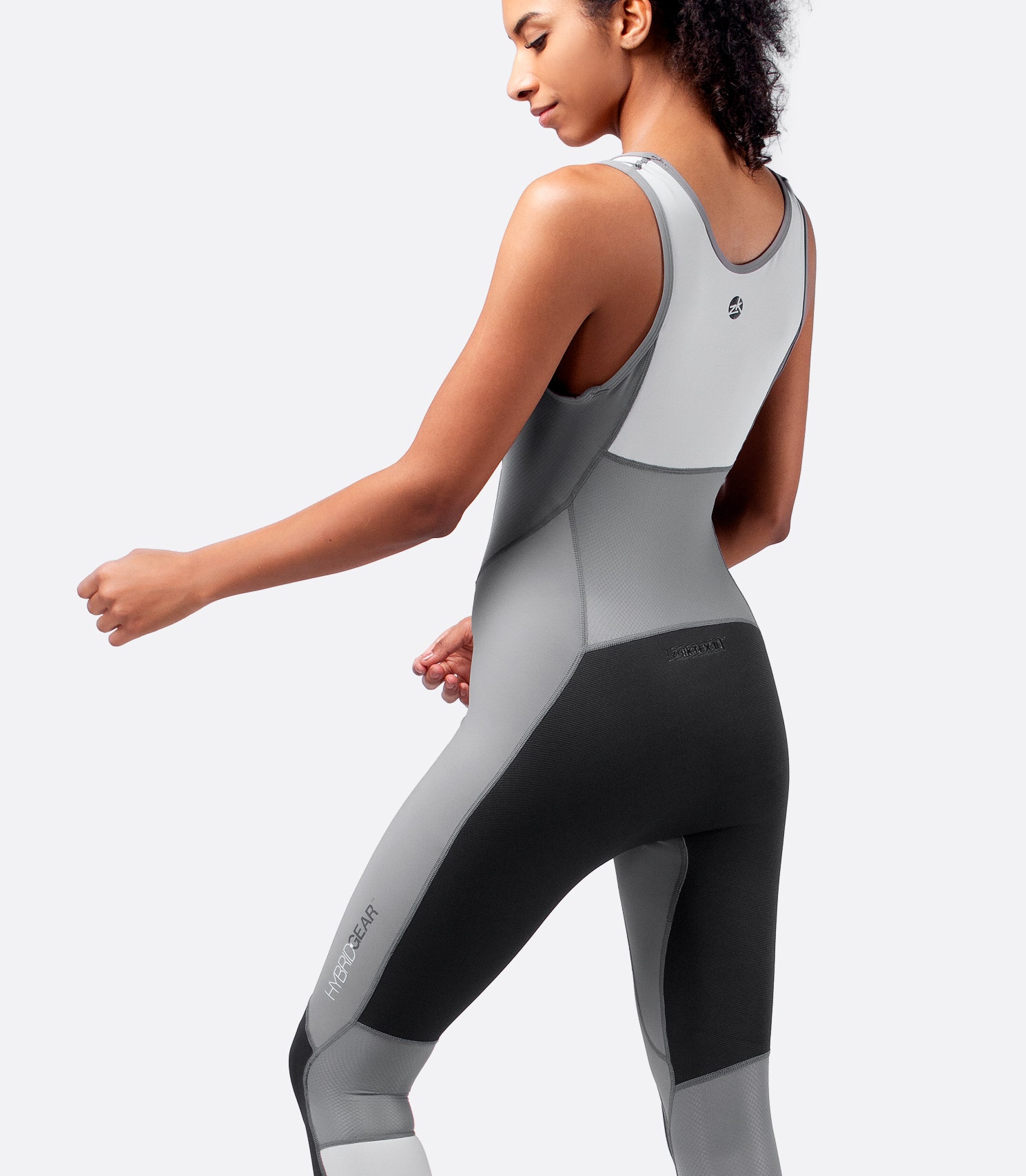 Back view of grey Zhik Hybrid Skiff Suit showcasing perforated padding and abrasion-resistant ZhikTex™ II panels on seat and knees.