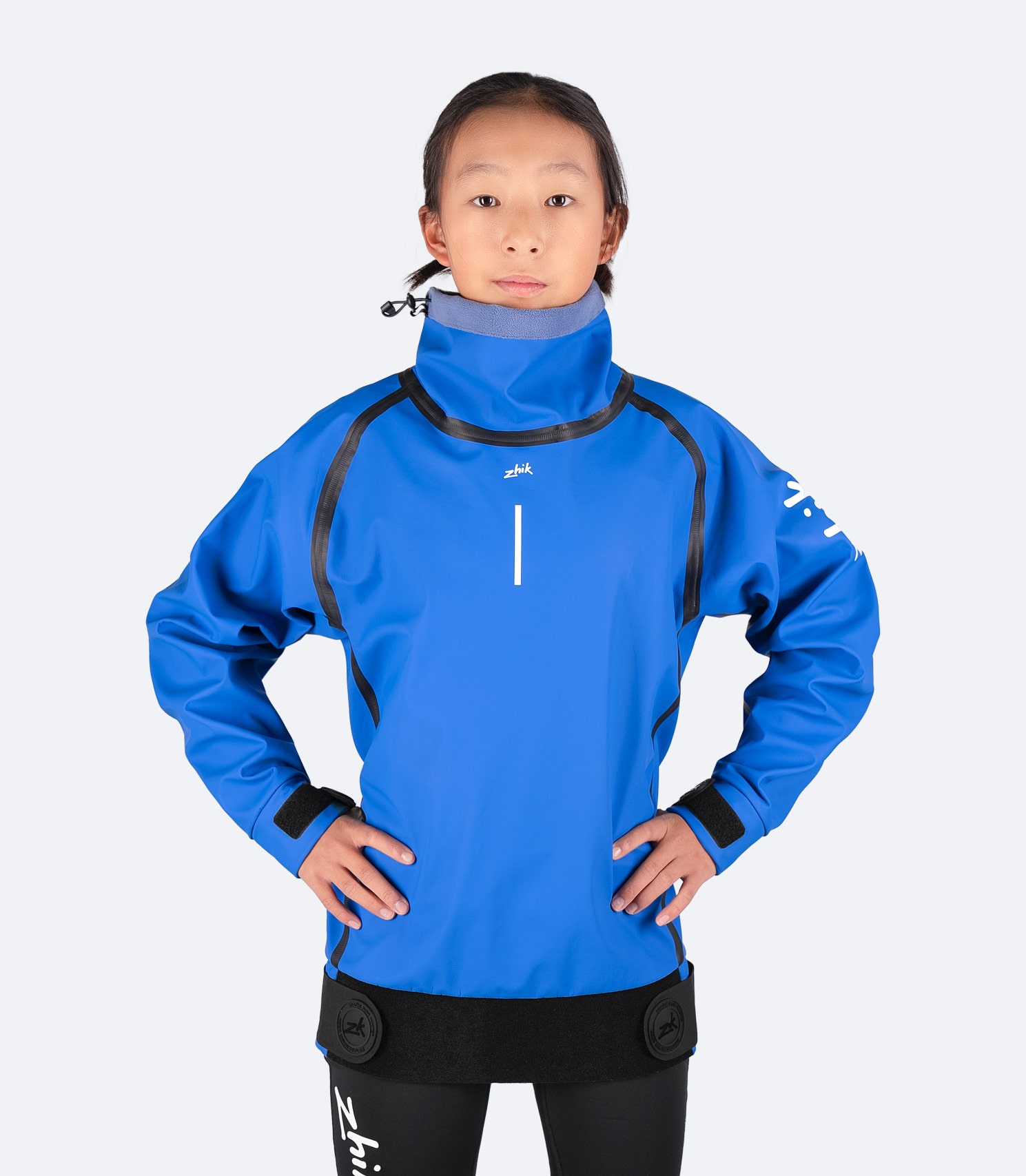 Zhik Youth Shedding Smock in blue, featuring waterproof PU fabric, high collar, and fleece lining for warmth