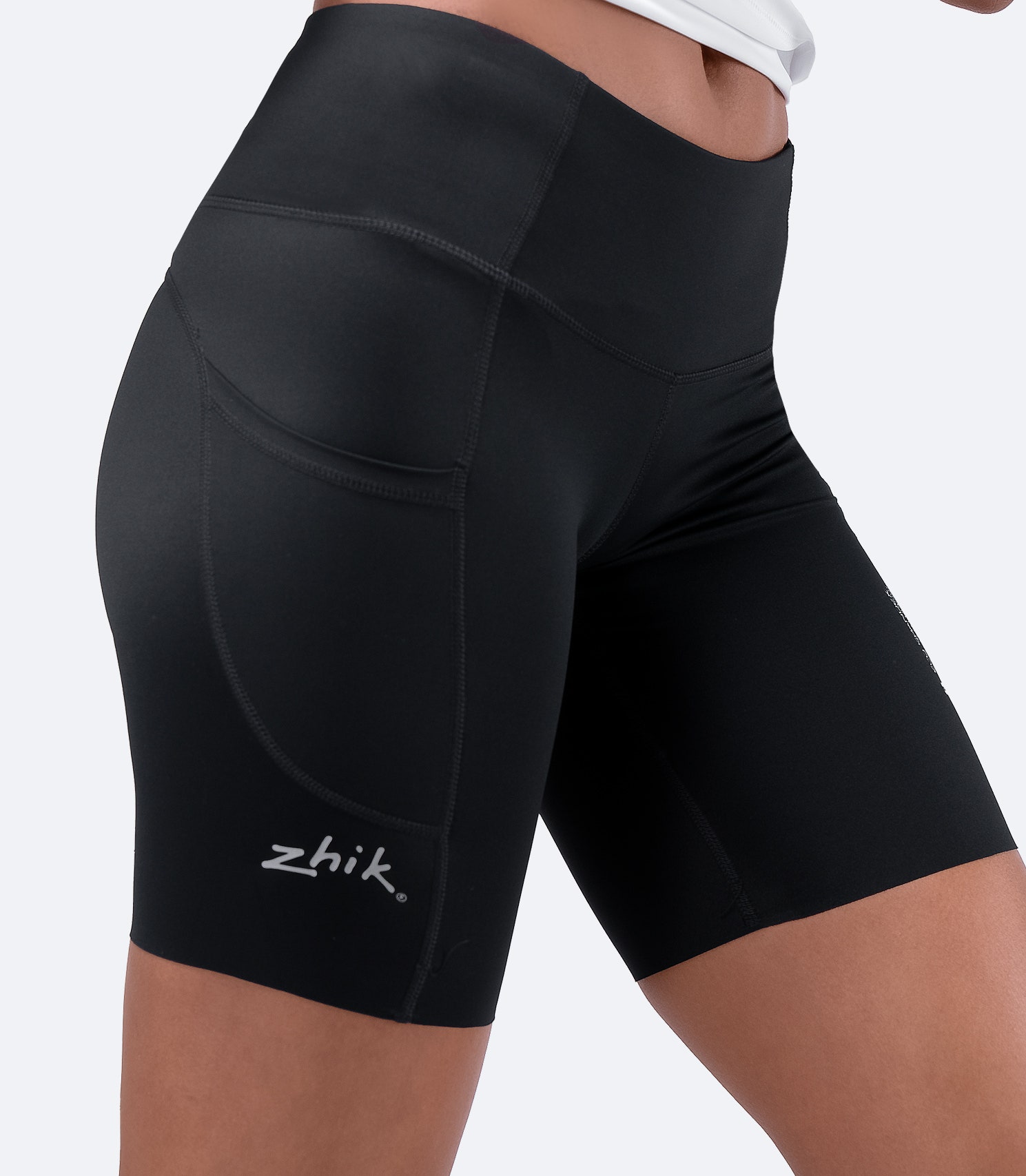 Close-up of Zhik Women's Eco Spandex Shorts in black, showcasing a secure waistband with continuous drawcord for a locked-in fit.