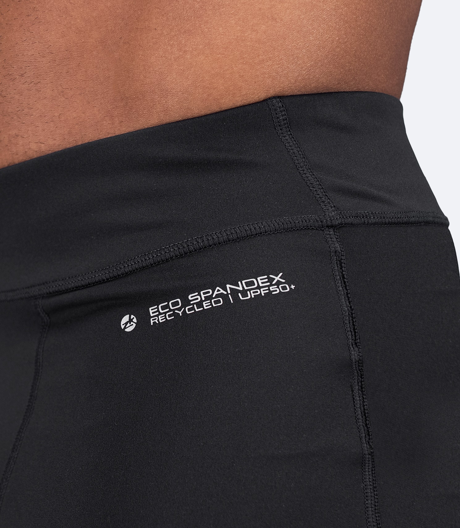 Side waist close-up of Zhik Men's Performance Paddle Short in black showing soft waistband and 4-way stretch paneling.