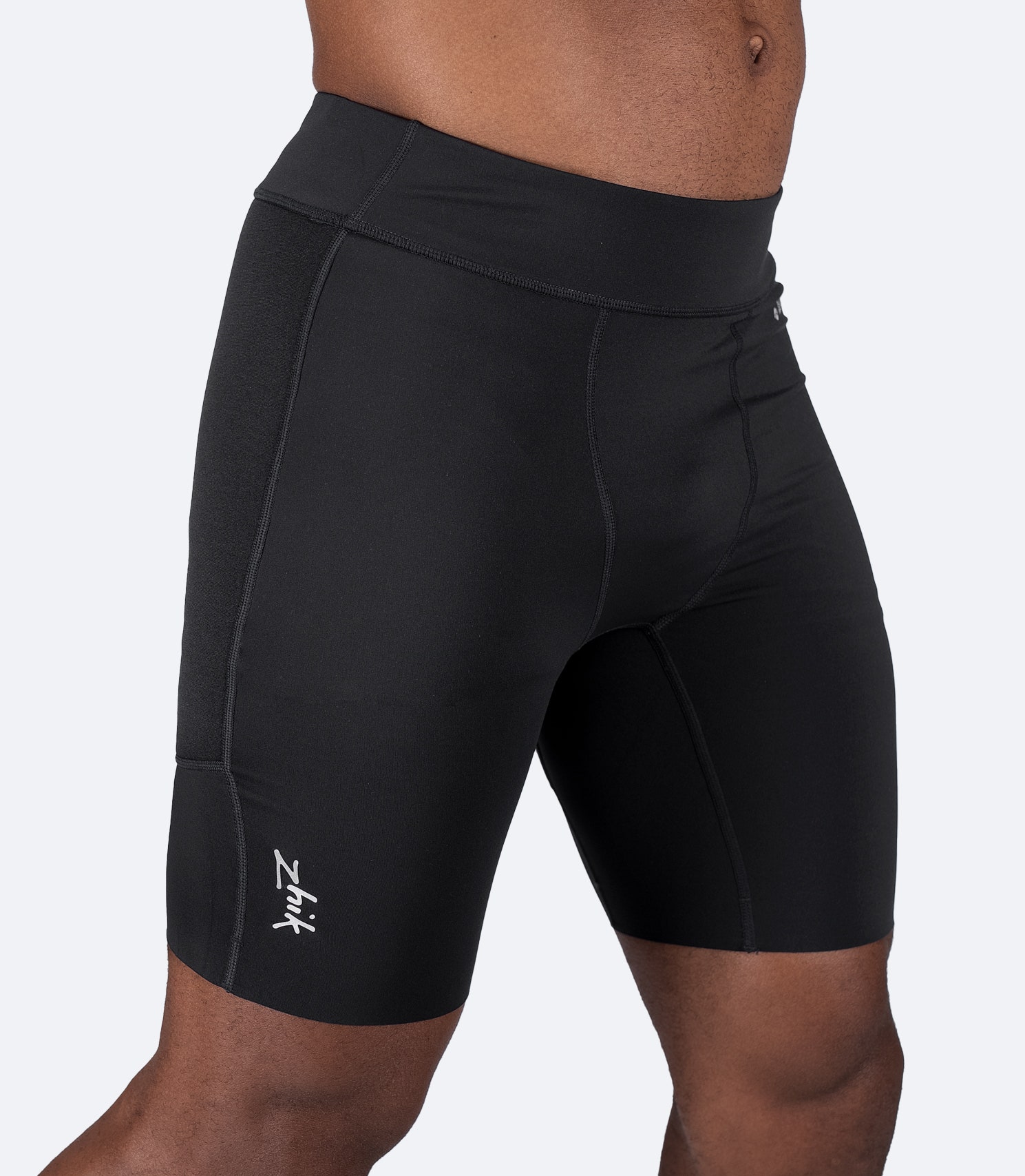 Side profile of Zhik Men's Padded Paddle Shorts highlighting anti-rash flatlock stitching and breathable fabric.