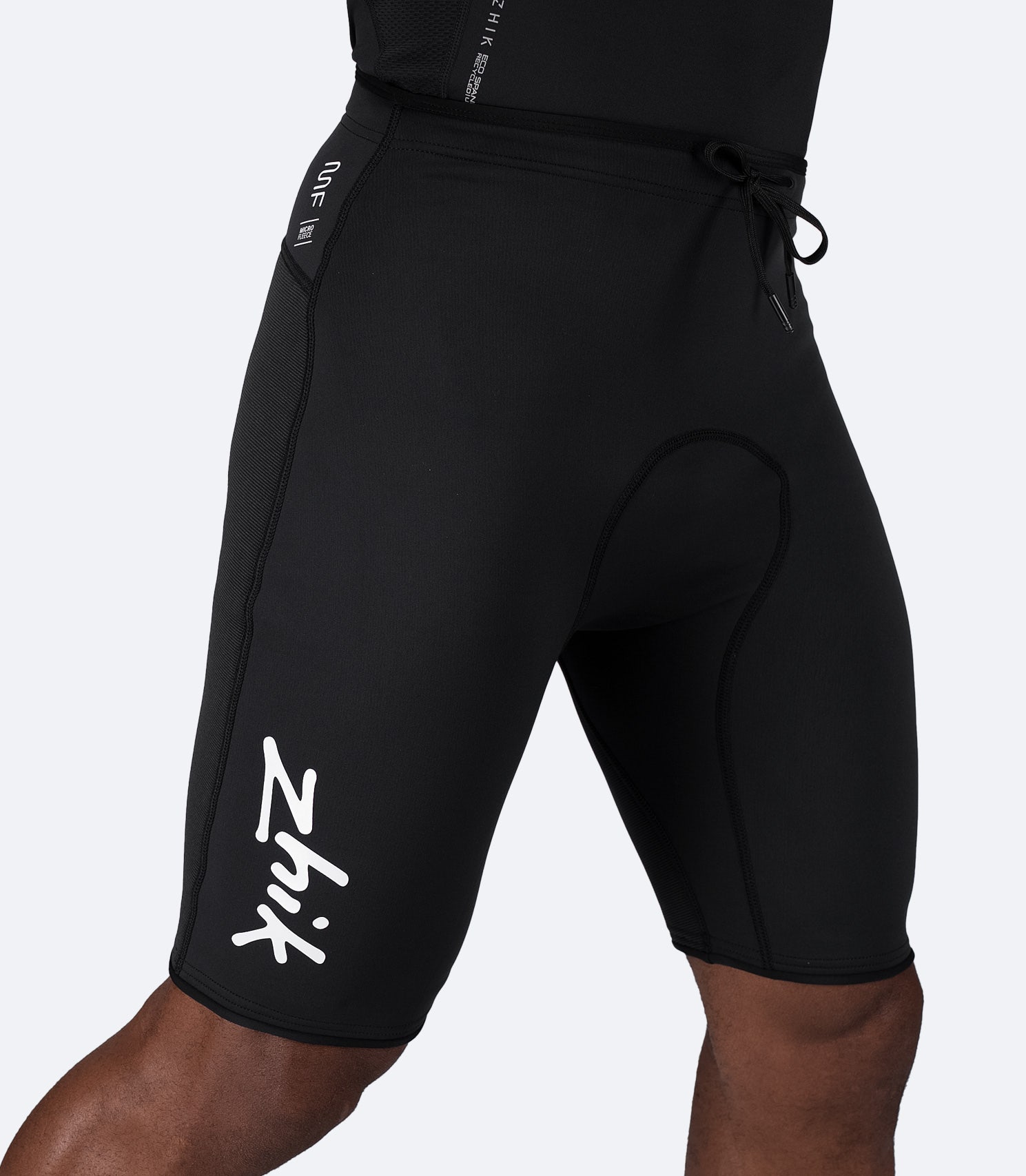 Zhik Microfleece™ Performance Shorts in black on male model, showing high-rise seat and 3D body-mapped fit.