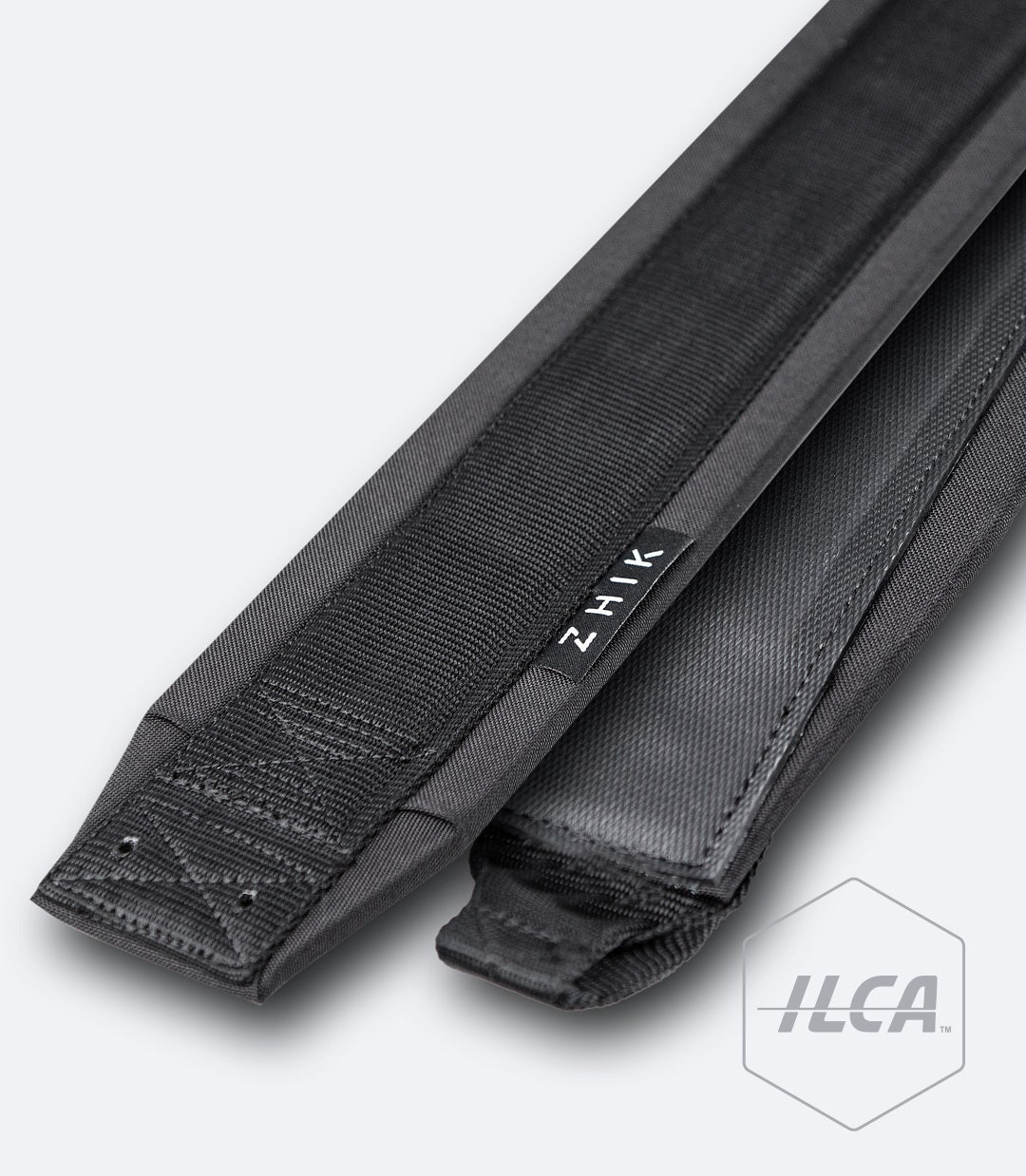 Black Zhik ILCA Dinghy Strap showing both top and bottom sides, durable nylon-rubber construction with looped and straight ends.