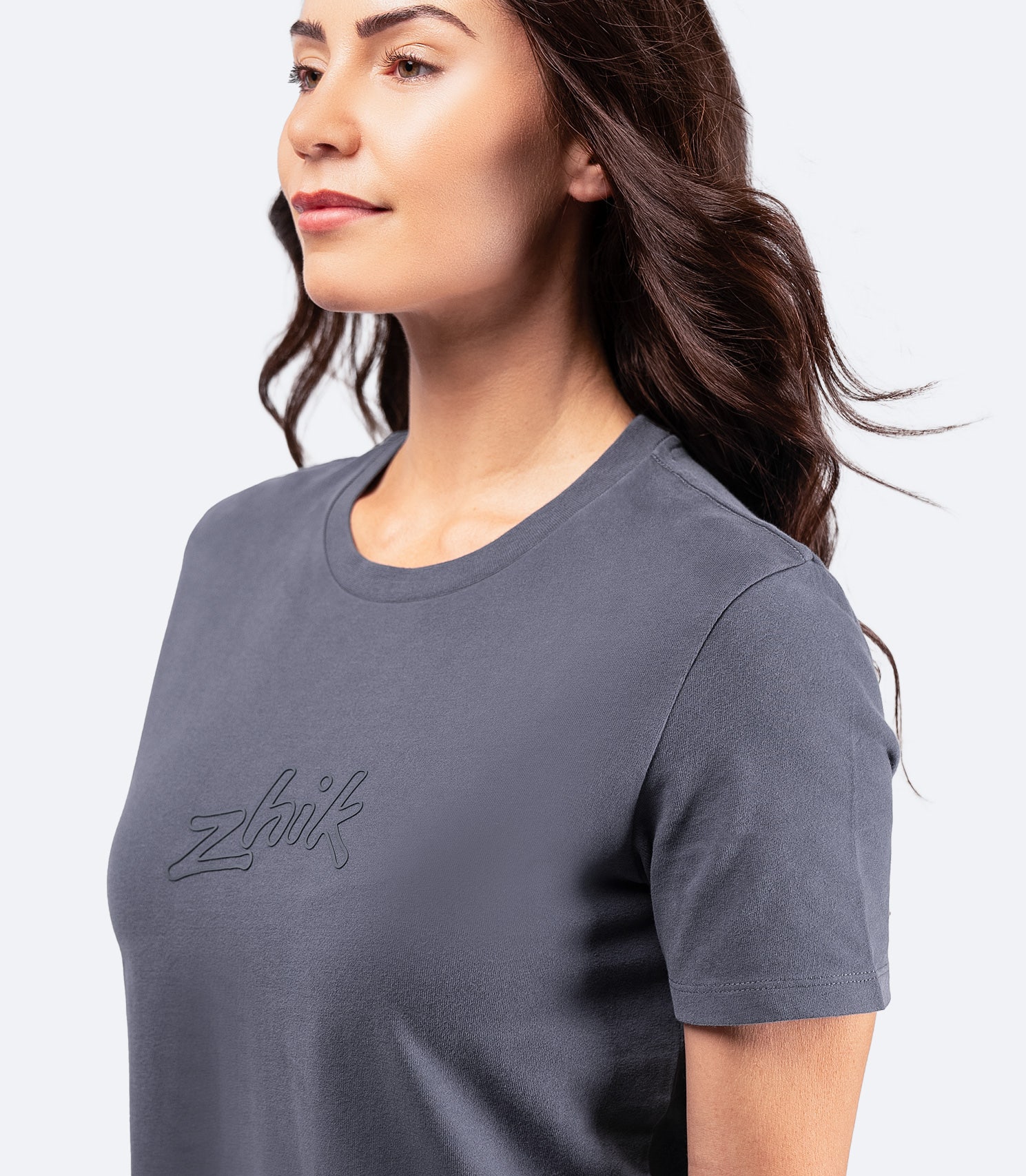 Side-angle shot of Women's Zhik Logo T-Shirt in navy, featuring a relaxed cropped fit and durable cotton construction.