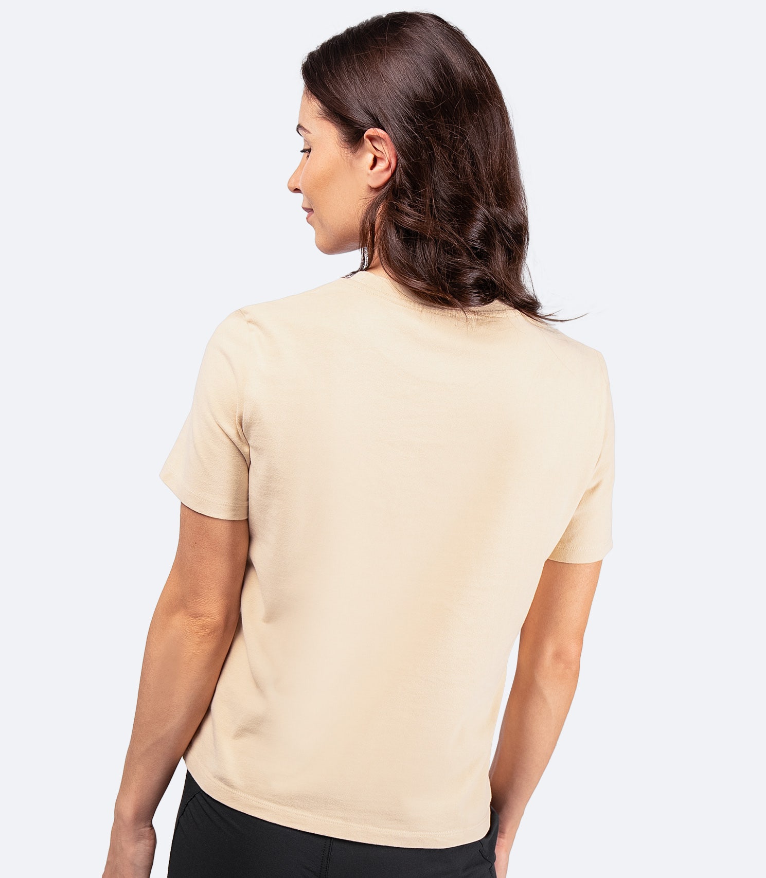 Back view of Women's Zhik Logo Cotton T-Shirt in sand, showing boxy silhouette and lightweight cotton for comfort on and off the water