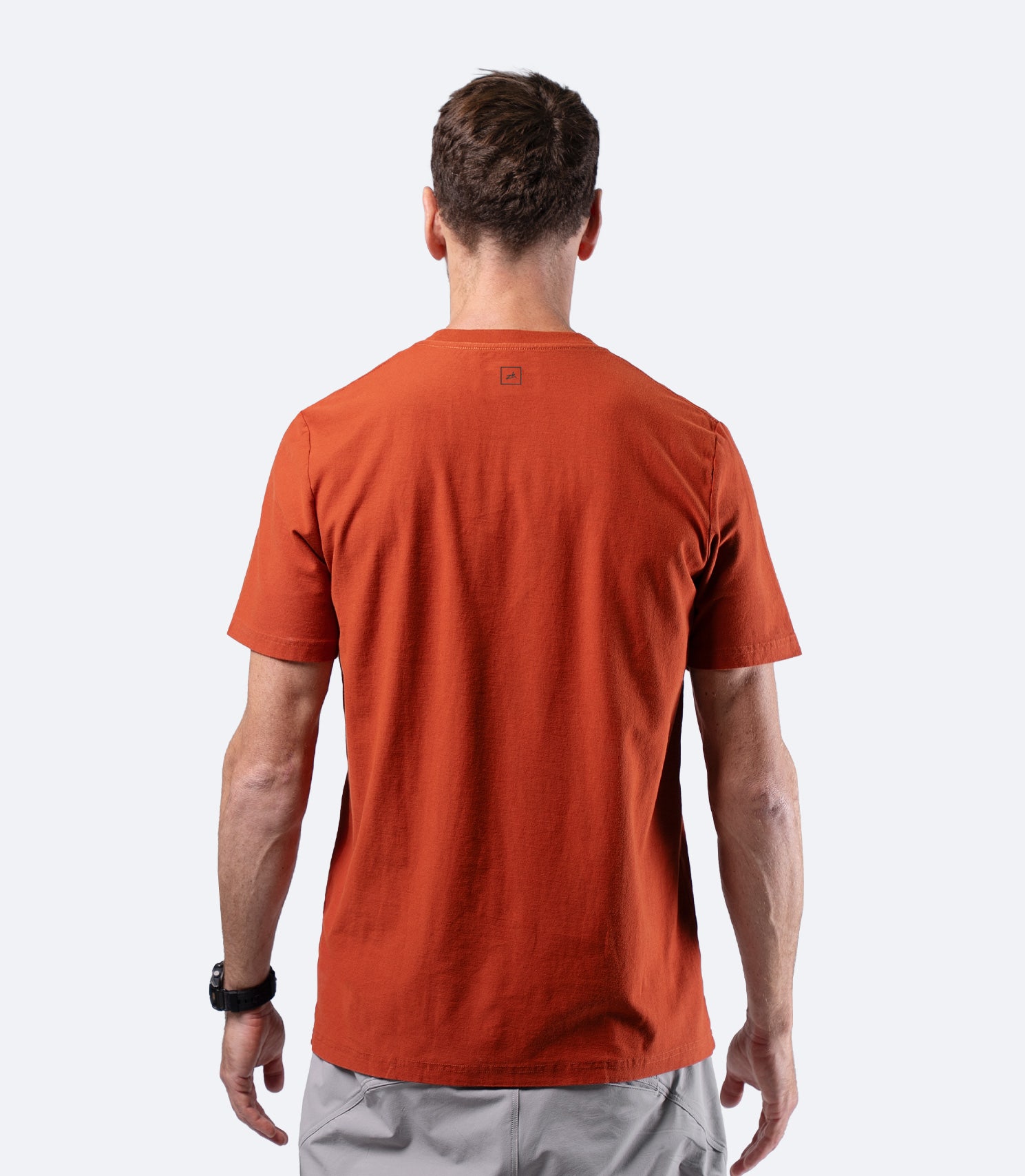 Zhik Men's Carbon T-shirt in Red Earth, rear view with clean tailored cut and minimalist styling