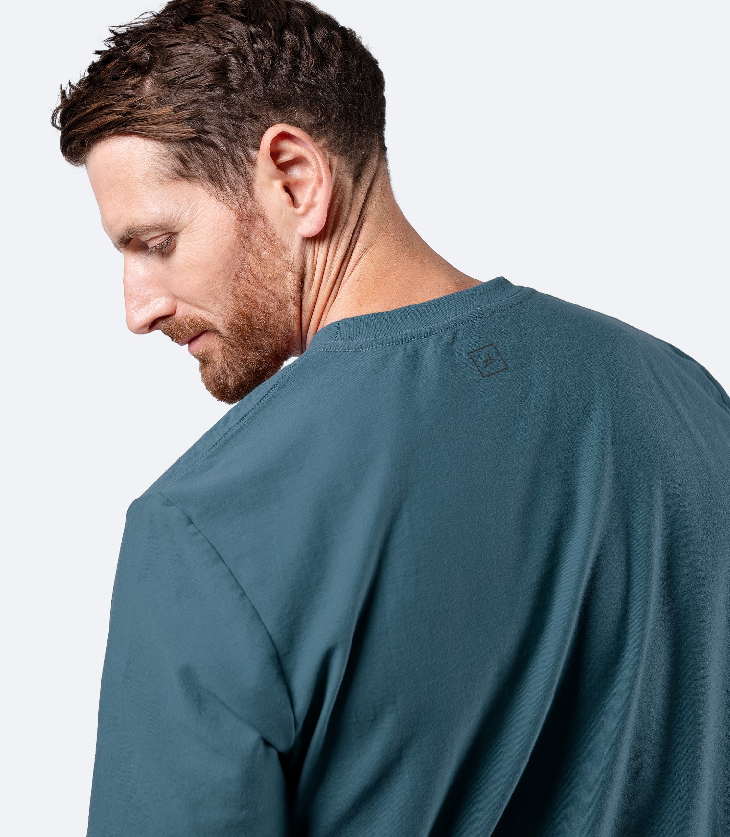 Rear shoulder close-up of Zhik Men's Carbon T-shirt in Deep Teal, highlighting smooth seams and structure