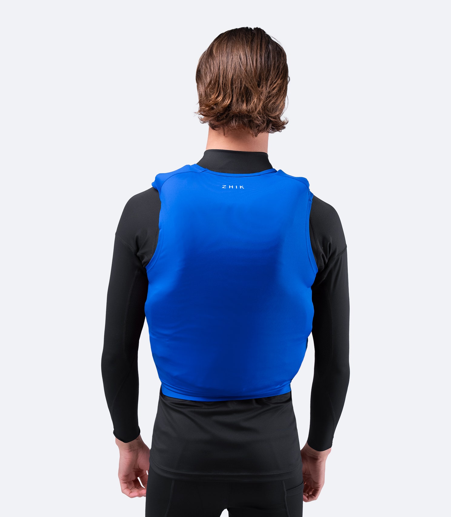 Zhik Spandex Event Pinnie in Cyan, rear view with built-in neckline, spreader bar locator, and reinforced seam construction.