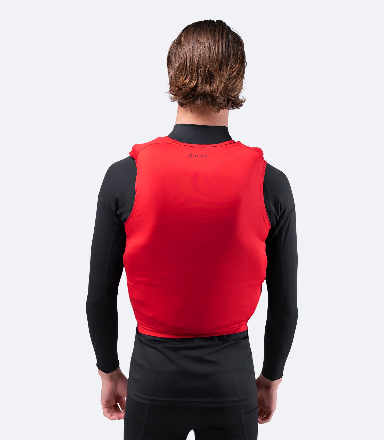 Back view of Zhik Spandex Event Pinnie in Red, featuring bar-tacked seam reinforcements and a spreader bar locator for secure fit.