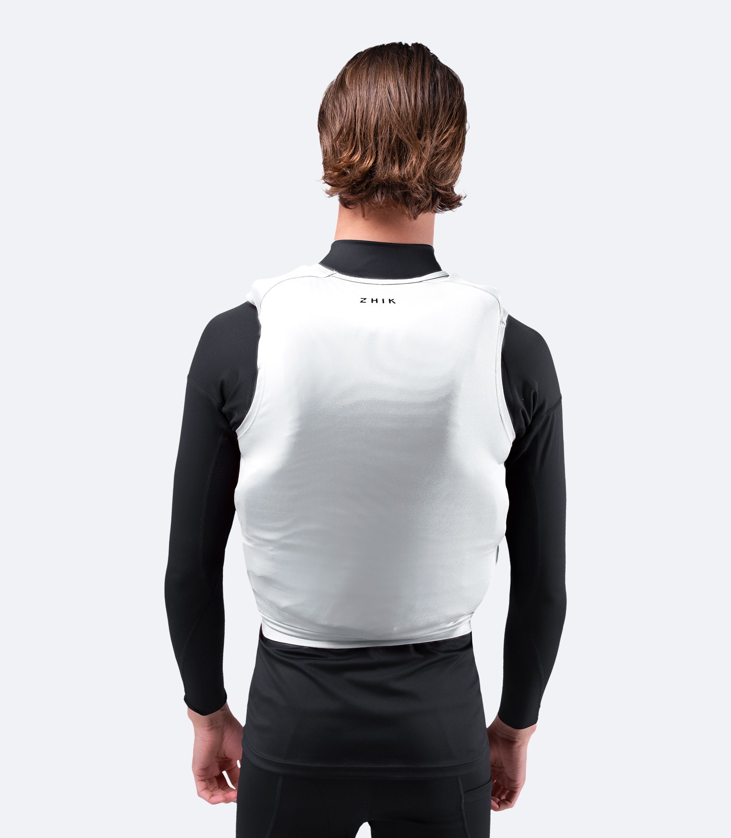 Zhik Spandex Event Pinnie in White, back view with a built-in neckline, reinforced seam ends, and spreader bar locator for a secure fit.