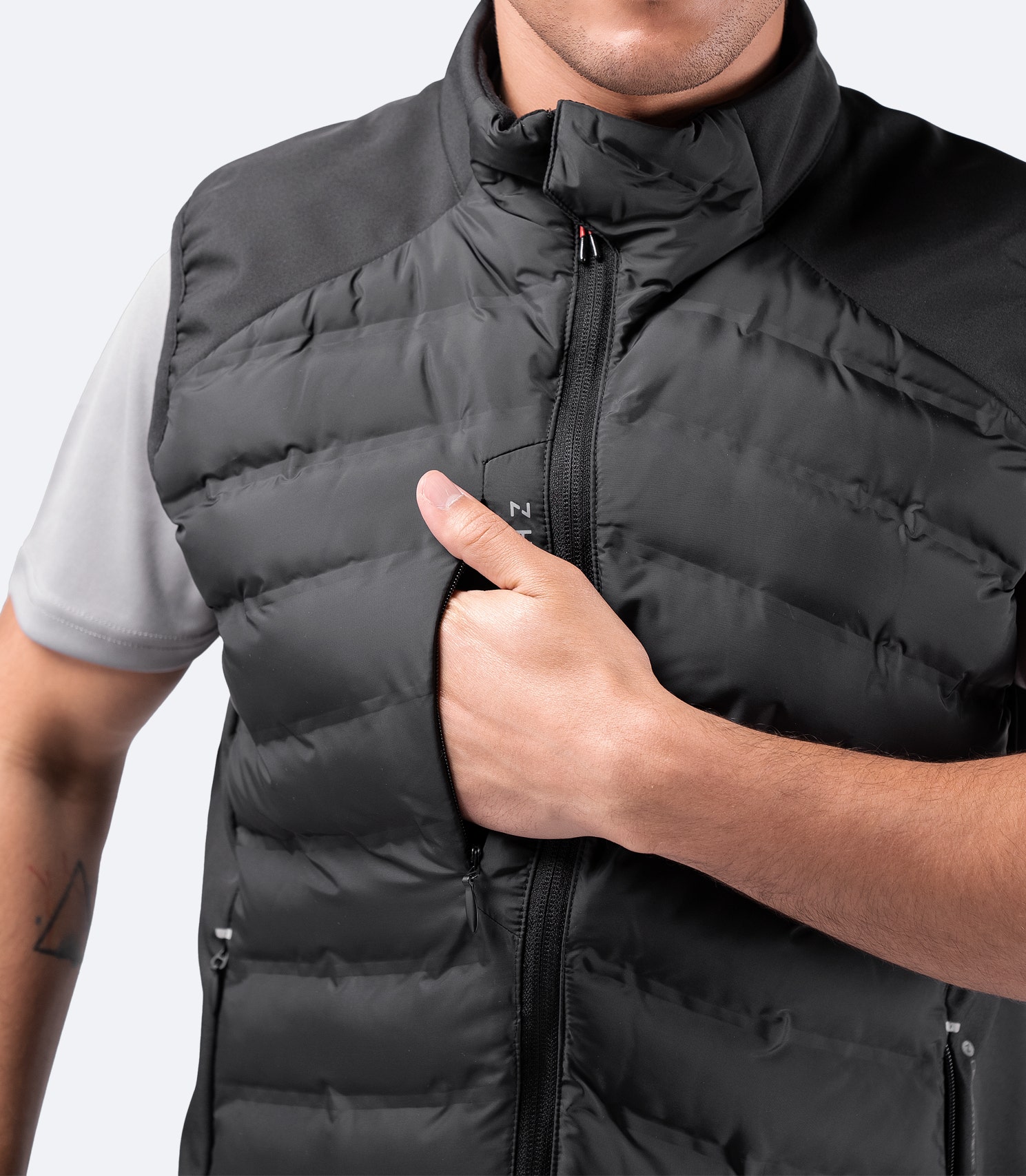 Close-up of Black Cell Vest zippered chest pocket – secure and accessible storage for small essentials.