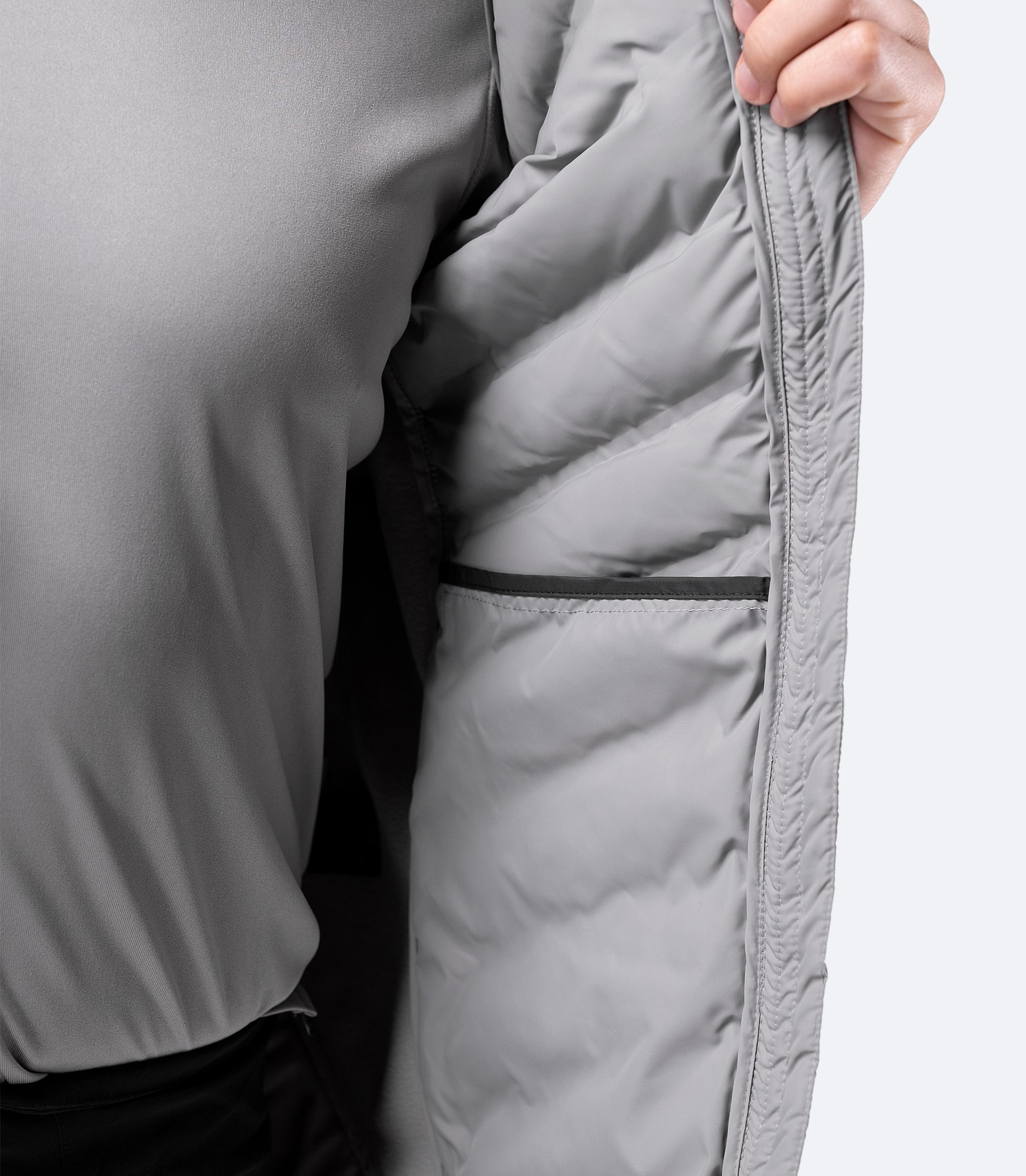 Close-up of Platinum Cell Vest internal stash pocket – spacious design for beanies, gloves, or accessories.