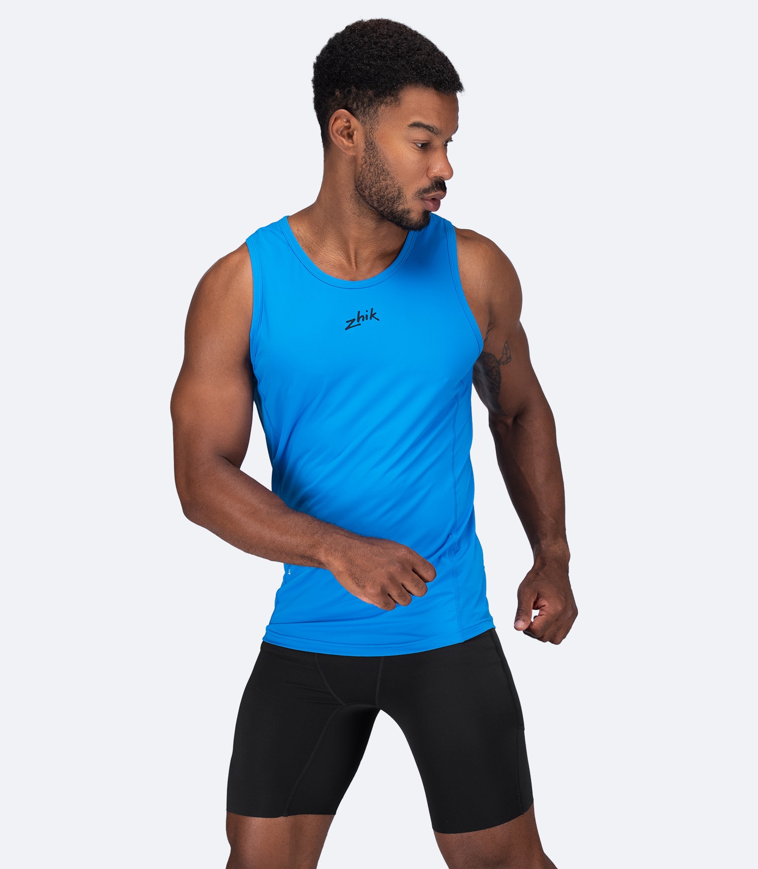 Zhik Men's Eco Spandex LT Race Singlet in Cyan, front view with relaxed fit and ultra-light recycled stretch fabric.