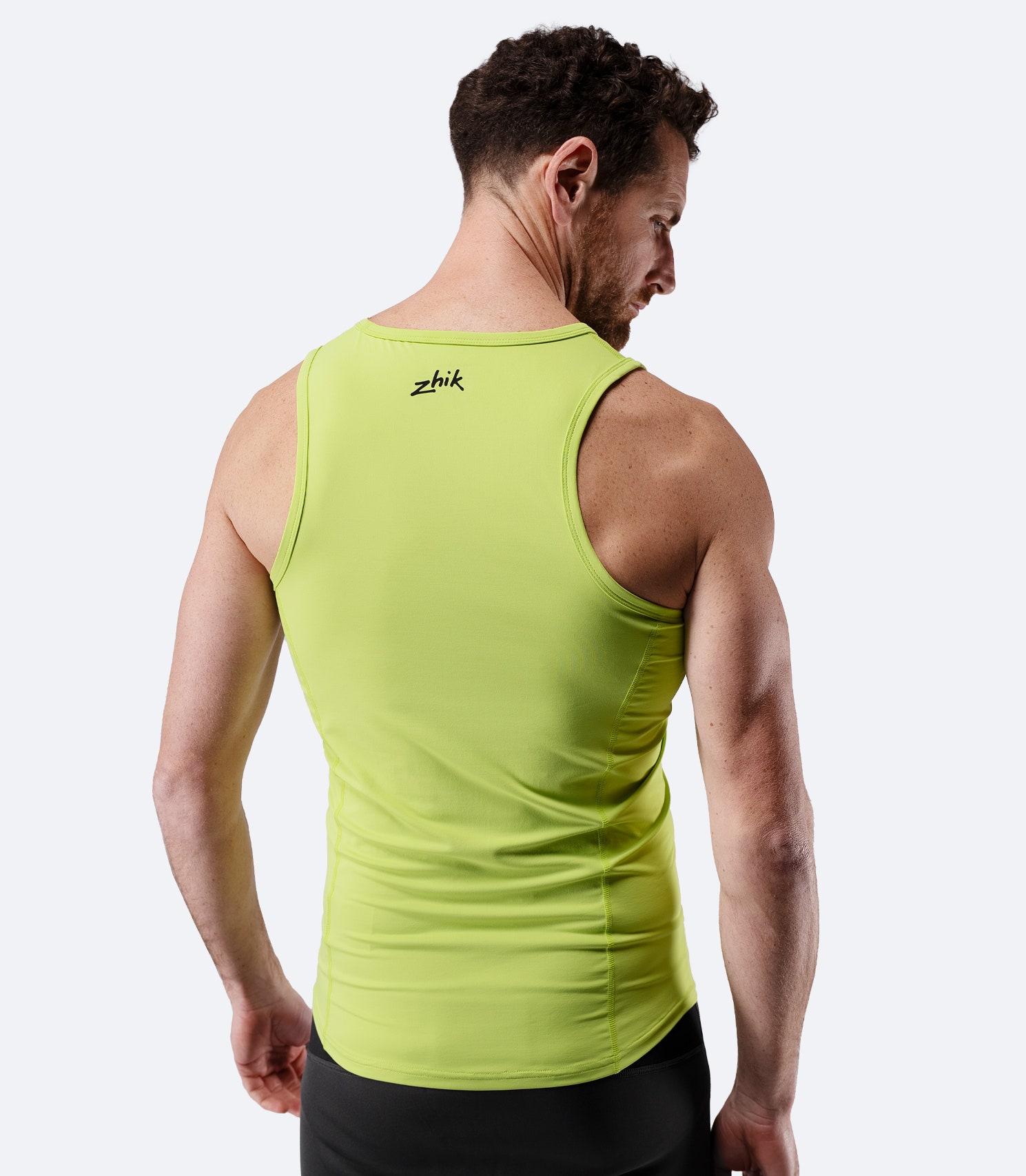 Zhik Men's Eco Spandex LT Race Singlet in lime, back view showing ergonomic seam placement and body contour fit.