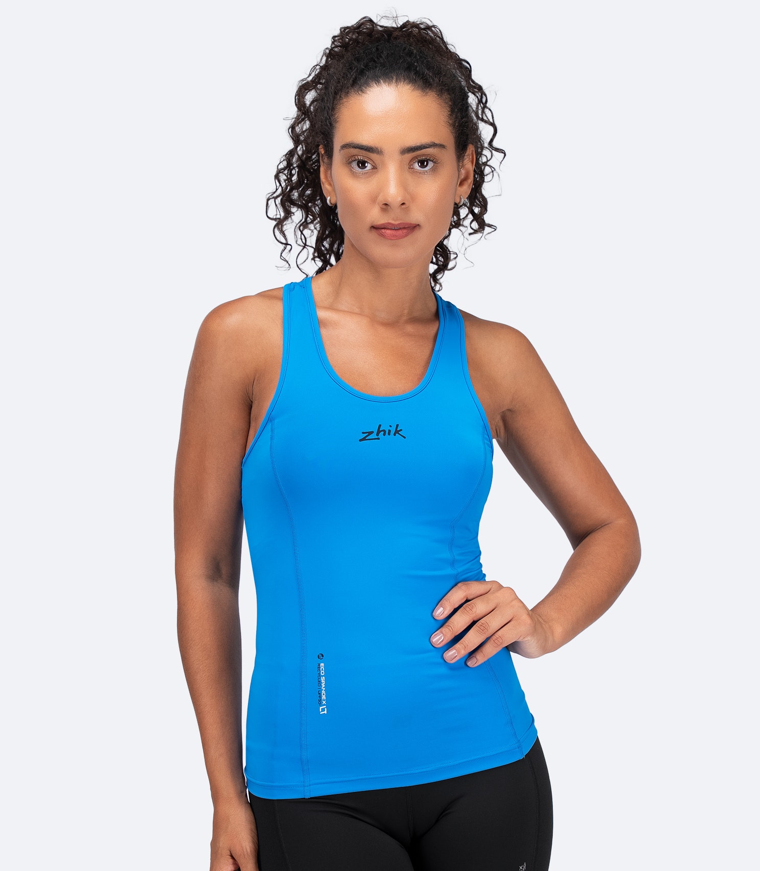 Zhik Women's Eco Spandex LT Race Singlet in Cyan with 3D body-mapped fit and ultra-light recycled fabric for paddle sports.