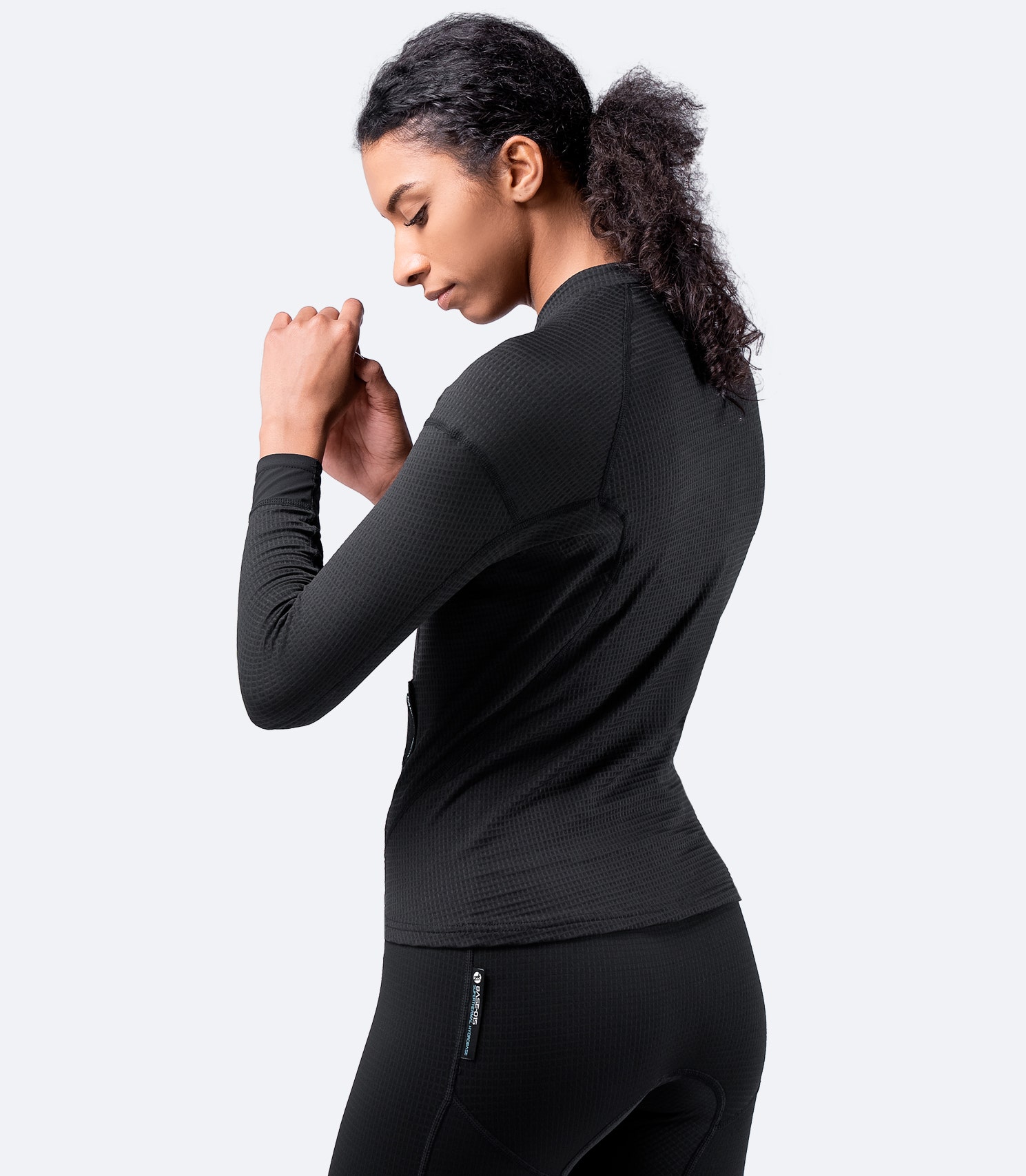 Black Superthermal™ Hydrobase® Top by Zhik, back view showing moisture-wicking fabric and ergonomic fit for high activity sports.