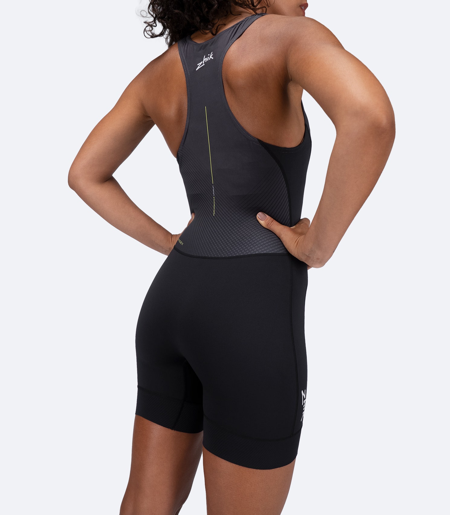 Back view of Women's Performance Unisuit in black by Zhik, highlighting reduced seams for advanced comfort and ergonomic fit.