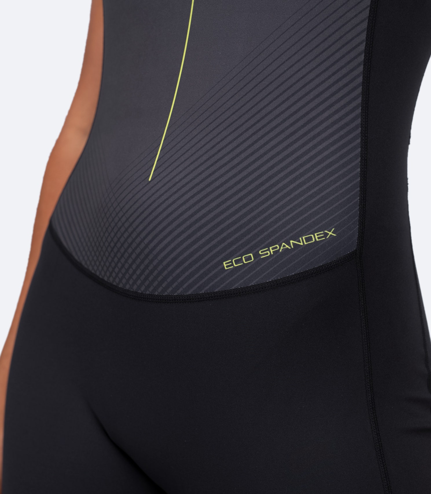 Close-up of lower front and waist area on Women's Performance Unisuit in black, emphasising breathable fabric and ergonomic fit.