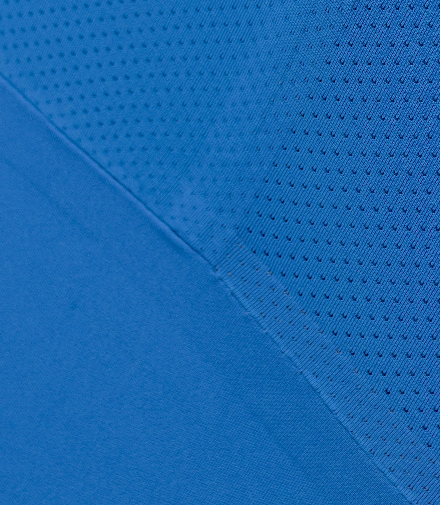 Close-up of Zhik Men’s X Unisuit in Blue showing graphene-infused fabric texture and stretch.