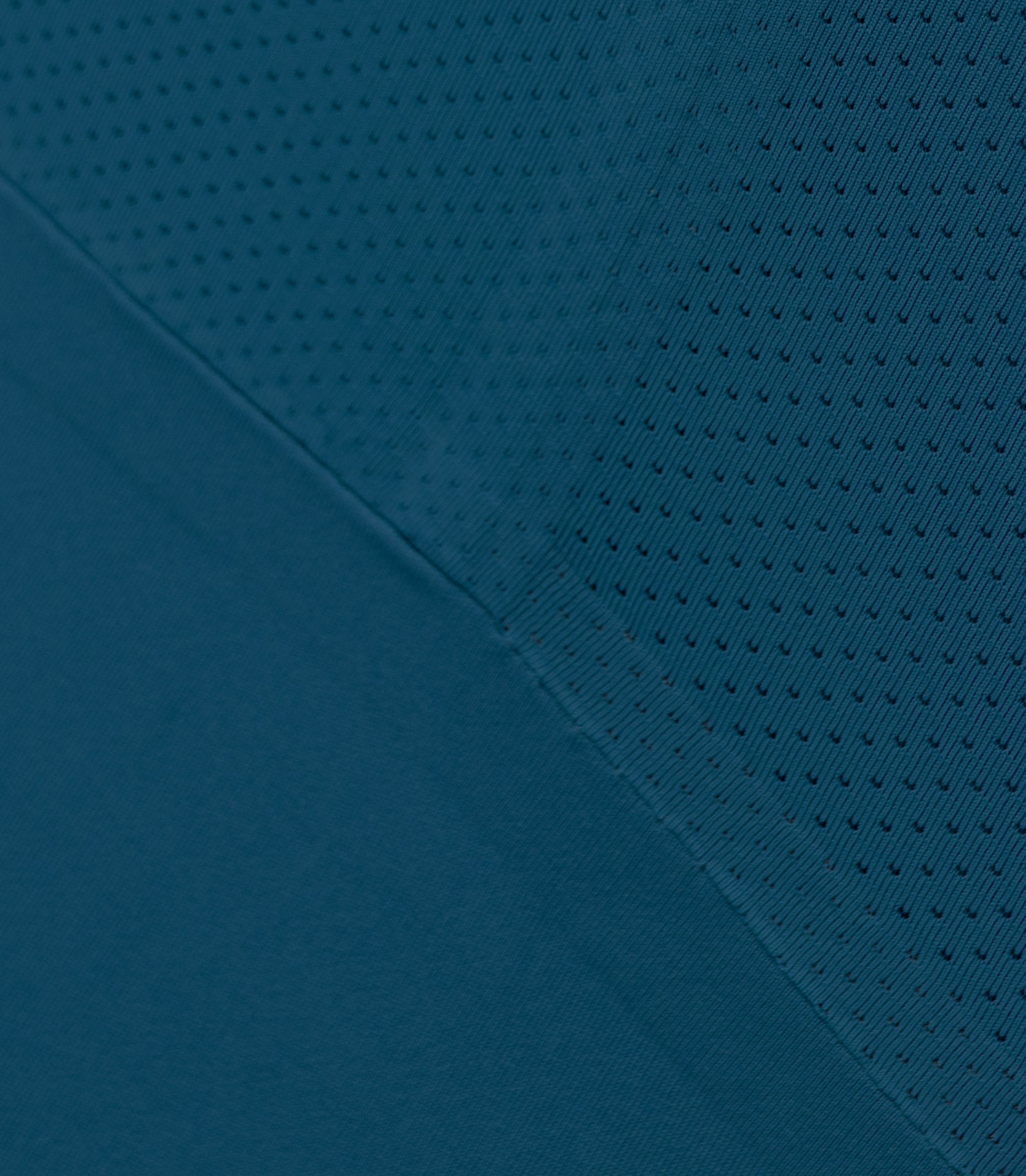 Close-up of Zhik Men’s X Unisuit in Deep Teal showing graphene-infused fabric texture and stretch.