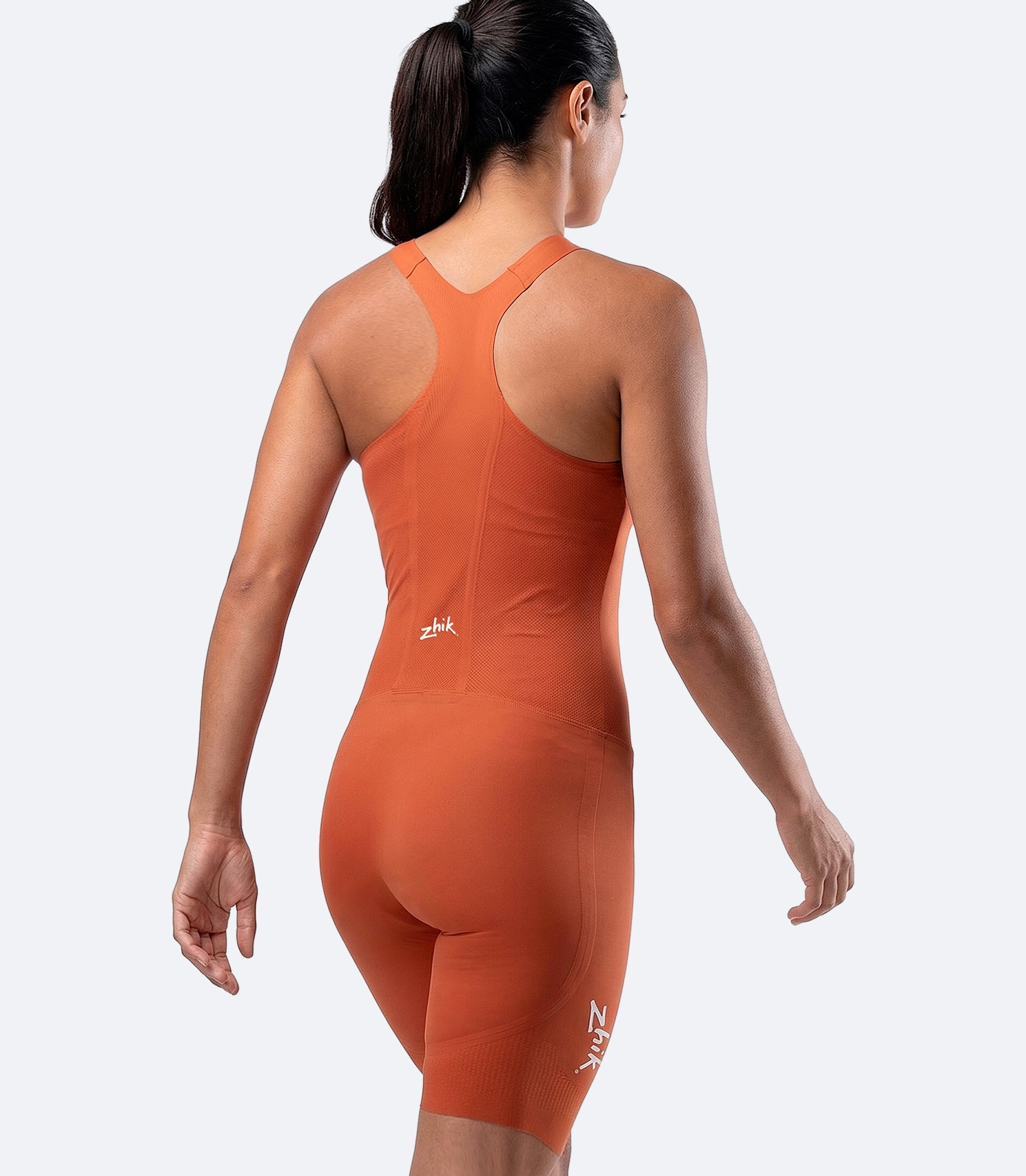 Rear view of Zhik Women’s X Unisuit in Red Earth with breathable mesh back panel and ergonomic performance fit.