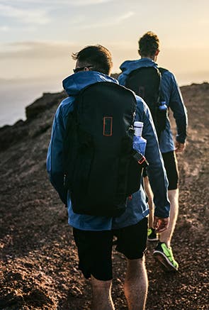 Men on hike with Zhik backpack